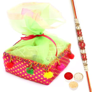 Colourful Almonds Pouch with Red Pearl Rakhi
