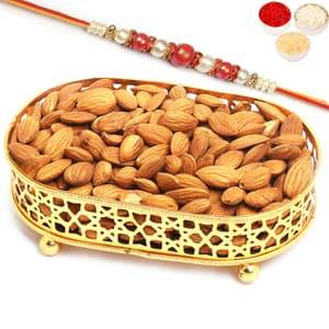 Golden Small Metal Tray filled with Almonds with Red Pearl Rakhi