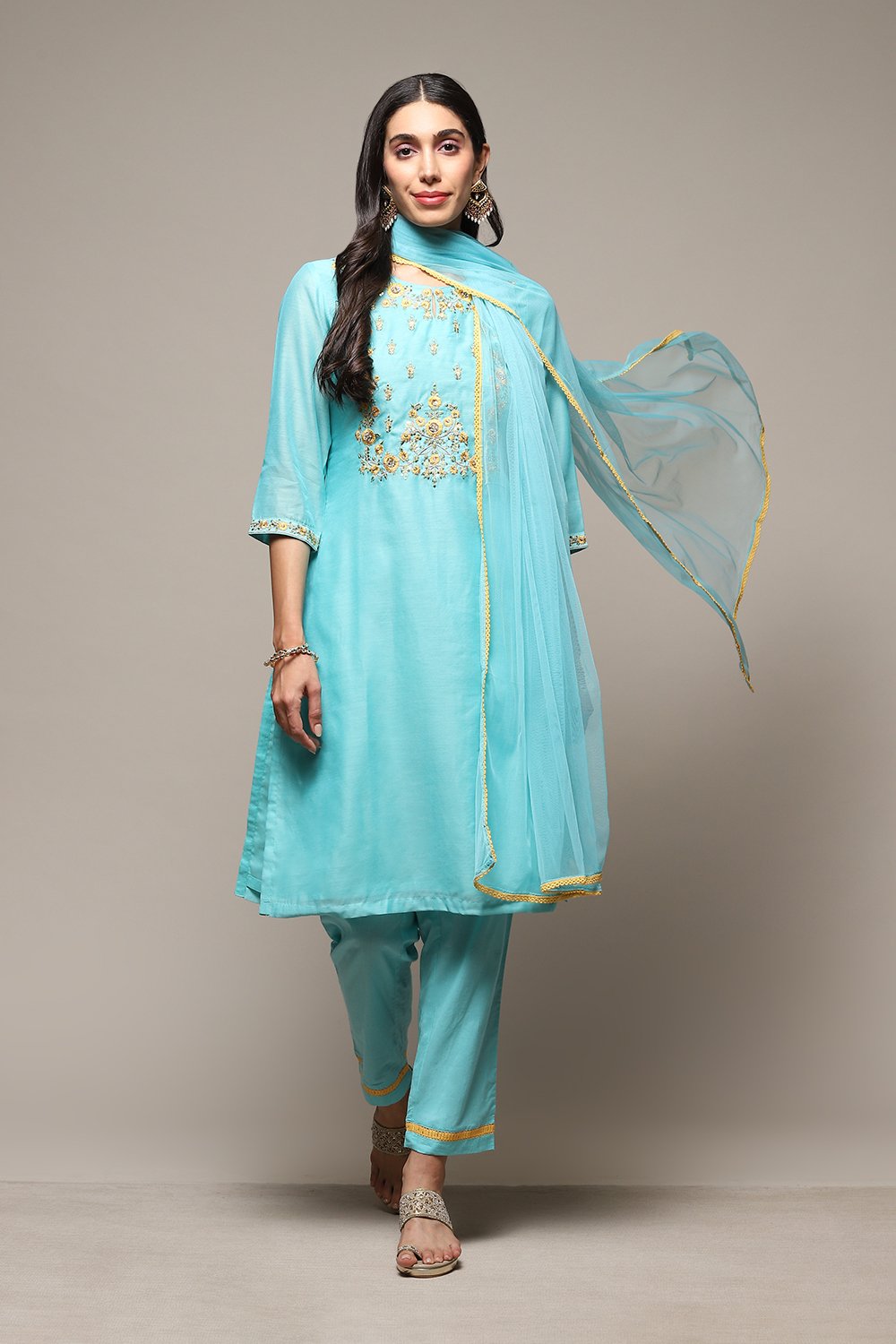 

Turquoise Yarndyed A-Line Kurta Regular Pant Suit Set