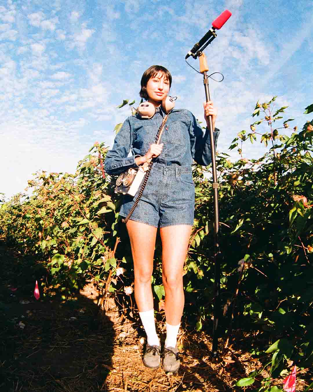 A woman who styled in Levi's Wellthread collection is holding a boom microphone  - Levi's Hong Kong