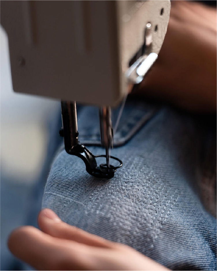 Repairing jeans with sewing machine - Levi's hong kong